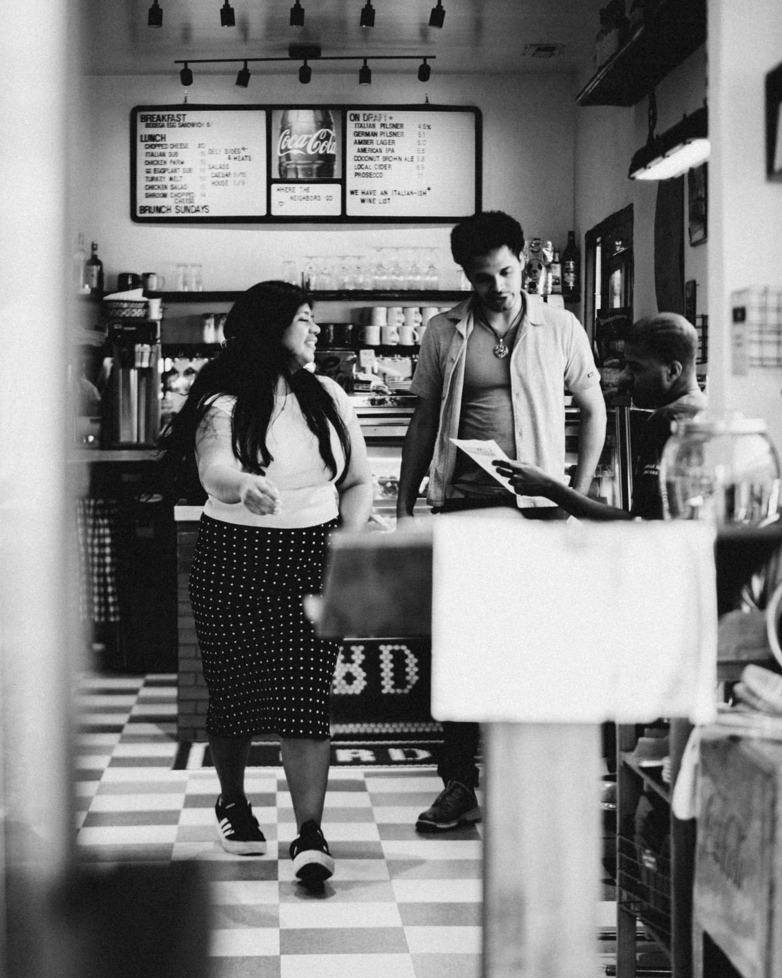 Guests at the counter inside the Finest deli in West Asheville